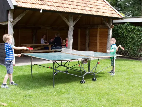Familiehuis met overdekt terras en grote tuin