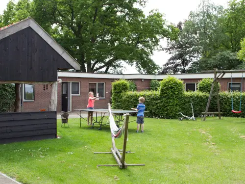 Familiehuis met overdekt terras en grote tuin